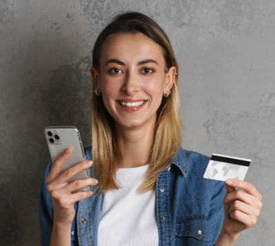 smiling woman holding a credit card
